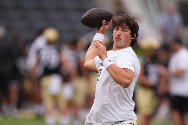 Georgia Tech transfer quarterback Aaron Philo will join new Florida offensive coordinator Buster Faulkner in Gainesville, where the two aim to revive the Gators' attack. Philo is pictured warming up before an NCAA college football game on Aug. 29, 2025, in Boulder, Colorado. (David Zalubowski/The Associated Press)