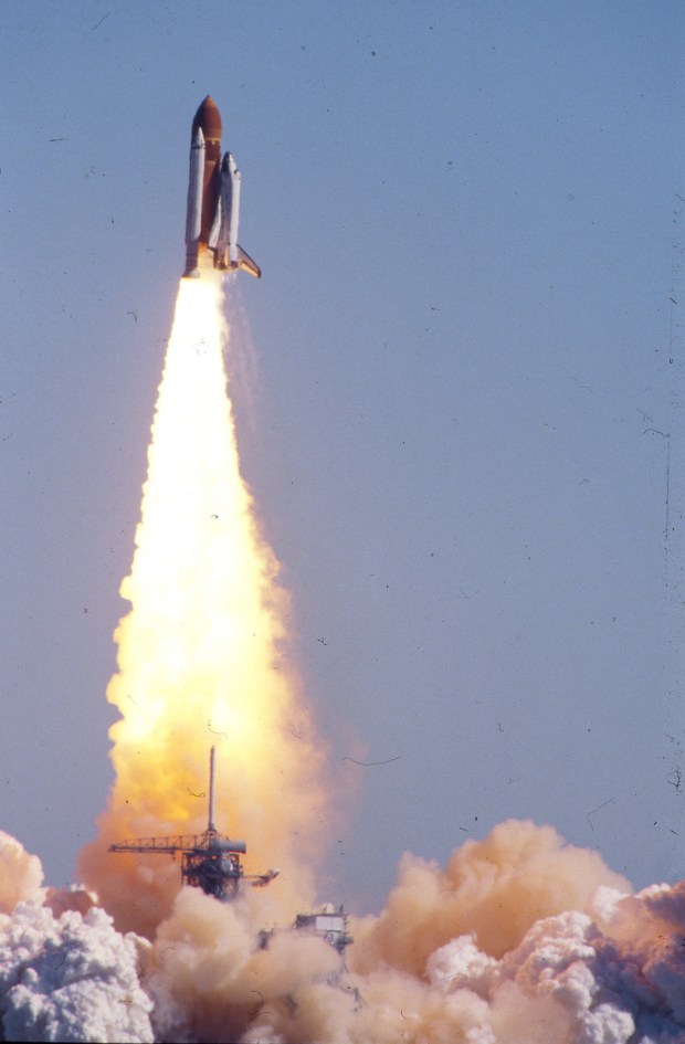 Launch of Space Shuttle Challenger on January 28, 1986. The shuttle was destroyed shortly after launch in an accident, killing the crew of seven astronauts. (Red Huber/Orlando Sentinel)