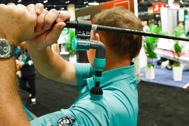 Mike Dickson gives a demo of the LagMaster training aid Jan. 22 at the PGA Show at Orange County Convention Center.(Rich Pope, Orlando Sentinel)