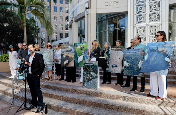 Andrew Marshall speaks during a press conference outside Orlando City Hall to call for changes to how the city cares for its iconic swans in Lake Eola Park, on Monday, January 26, 2026. (Ricardo Ramirez Buxeda/ Orlando Sentinel)
