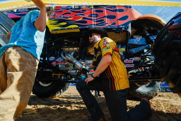 JCB Digatron driver Tristan England gets up under Classroom Crusher with August Dixon. Taken during the Blind Touch-A-Truck event for kids and teenagers from Lighthouse Central Florida on Friday, January 9, 2025. (Rich Pope/Orlando Sentinel)