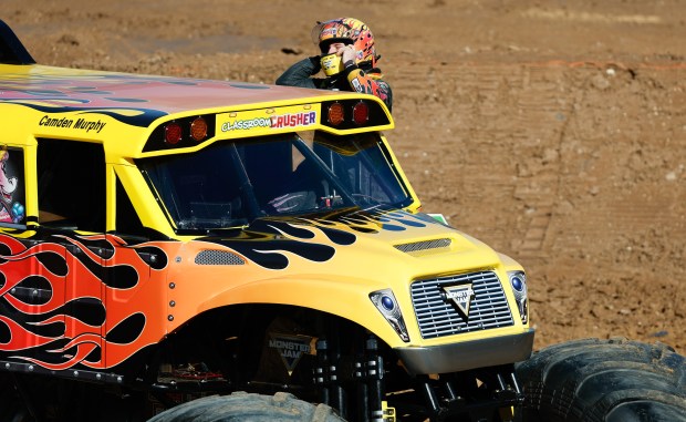 Camden Murphy crawls out of Classroom Crusher after taking a roaring lap on the stadium floor. Taken during the Blind Touch-A-Truck event for kids and teenagers from Lighthouse Central Florida on Friday, January 9, 2025. (Rich Pope/Orlando Sentinel)