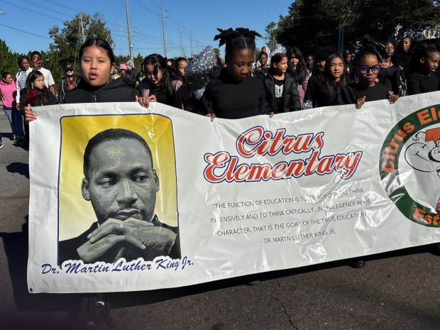 Students from Citrus Elementary walk and wave to spectators during Ocoee's 18th Annual Dr. Martin Luther King, Jr., Unity Parade on Monday, January 19, 2026. (Rich Pope/Orlando Sentinel)