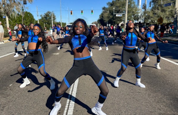 Members from the E&D Dance Troupe perform during Ocoee's 18th Annual Dr. Martin Luther King, Jr., Unity Parade on Monday, January 19, 2026, as community officials, charities, clubs and youth organizations from Orange County and the surrounding neighborhoods bundled up for a cold morning parade to celebrate the legacy of America's famous civil rights leader. (Rich Pope/Orlando Sentinel)