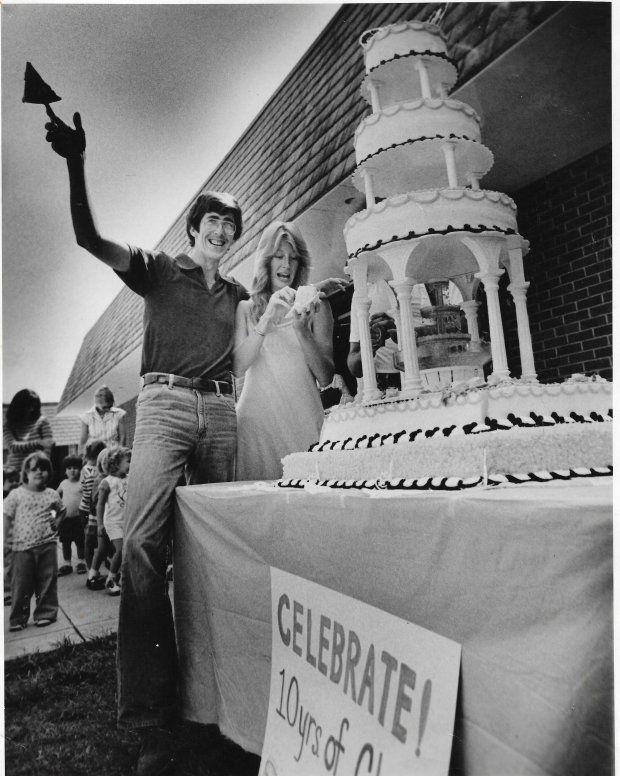 "Happy Birthday" is the tune of the day as Florida Technological University celebrates 10 years of classes on Oct. 10, 1978, In the background future students from the child care center at FTU sing for the occasion as Mark O'Mara, student body president, cuts and presents the first piece of cake to student Laura Wade. (Sentinel file)
