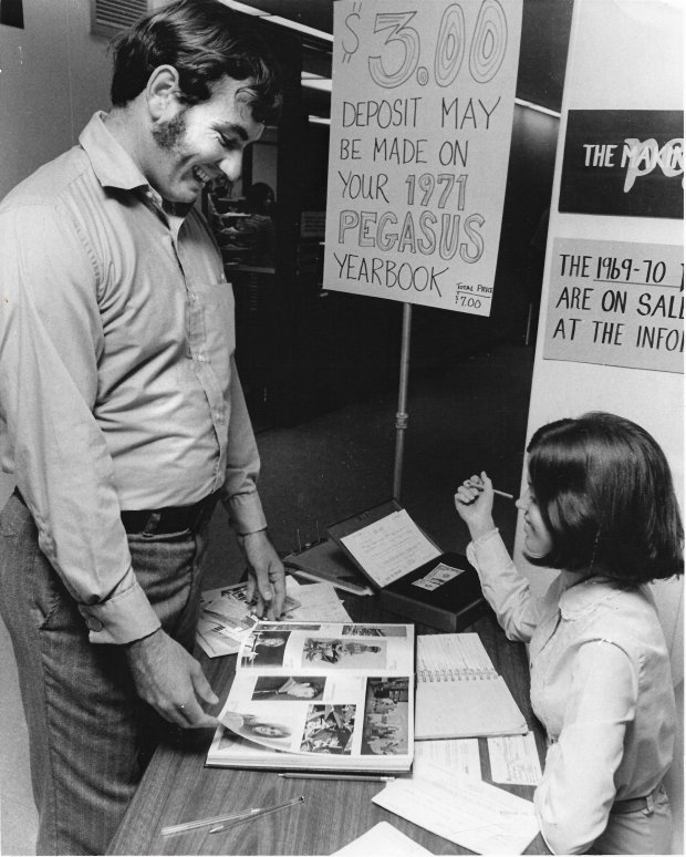 Sharron Warren, first year student in secondary education from Casselberry, tries to sell the FTU Pegasus yearbook to Jim Runnels, a freshman Business Administration student from Orlando in the photo from January 1971. (Sentinel file)