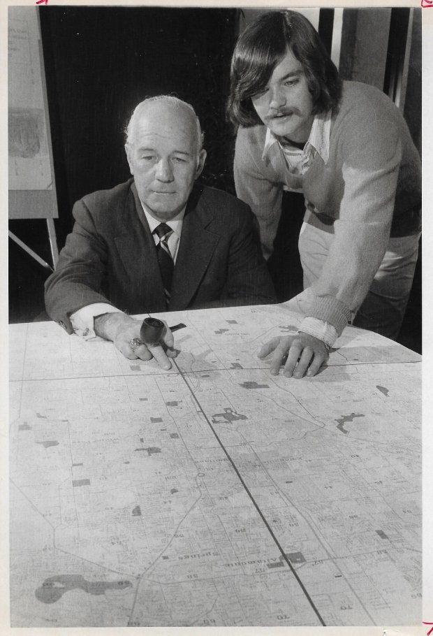 FTU President Charles Millican and student president Lee Constantine look at a grid map to plot a car pool in this Dec. 8, 1973 photo. (Sentinel file)
