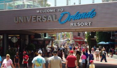 Guests stream beneath the iconic "Welcome to Universal Orlando Resort" archway in Universal CityWalk