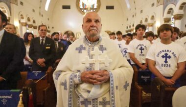 Thousands in Florida's Greek community watch as teens dive for cross