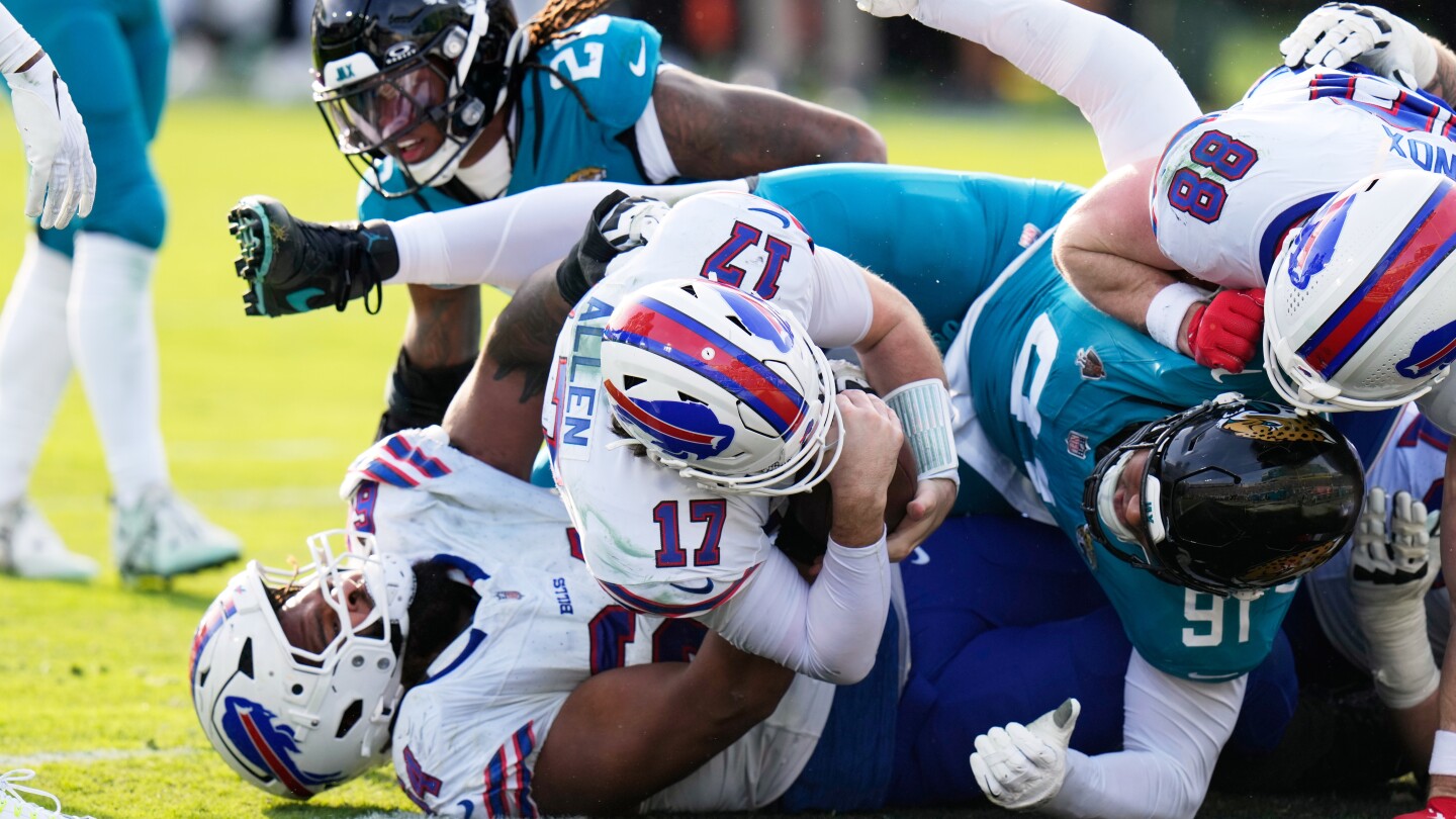 Josh Allen carries Bills to 27-24 win at Jags for Buffalo's first road playoff victory in 33 years