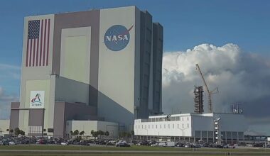 Smoke plumes from a controlled burn on Merritt Island can be seen behind Kennedy Space Center's Vehicle Assembly Building on Jan. 9, 2026. (Spectrum News)