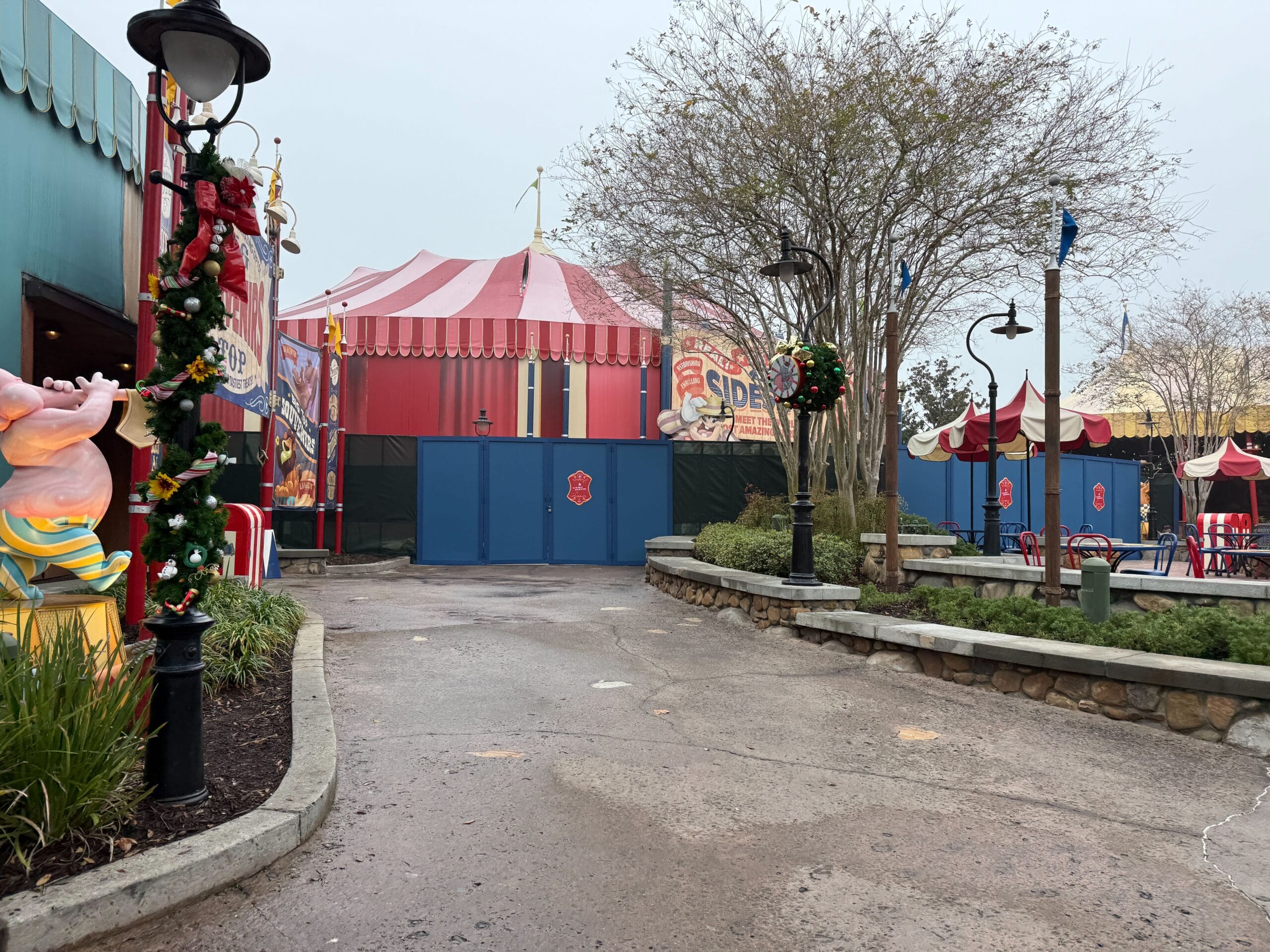 Blue walls and green scrim are in front of the Pete's Silly Sideshow tent.