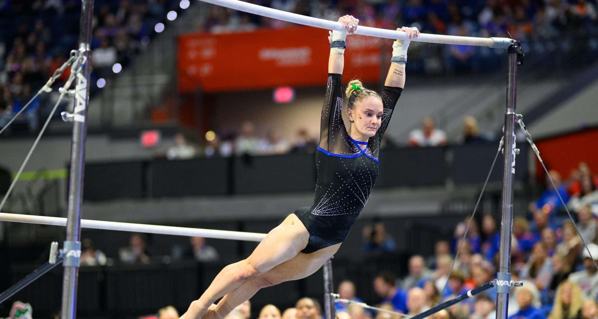 Riley McCusker swings on the bars as Florida gymnastics beat Arkansas on Friday, Jan. 30, in Gainesville.