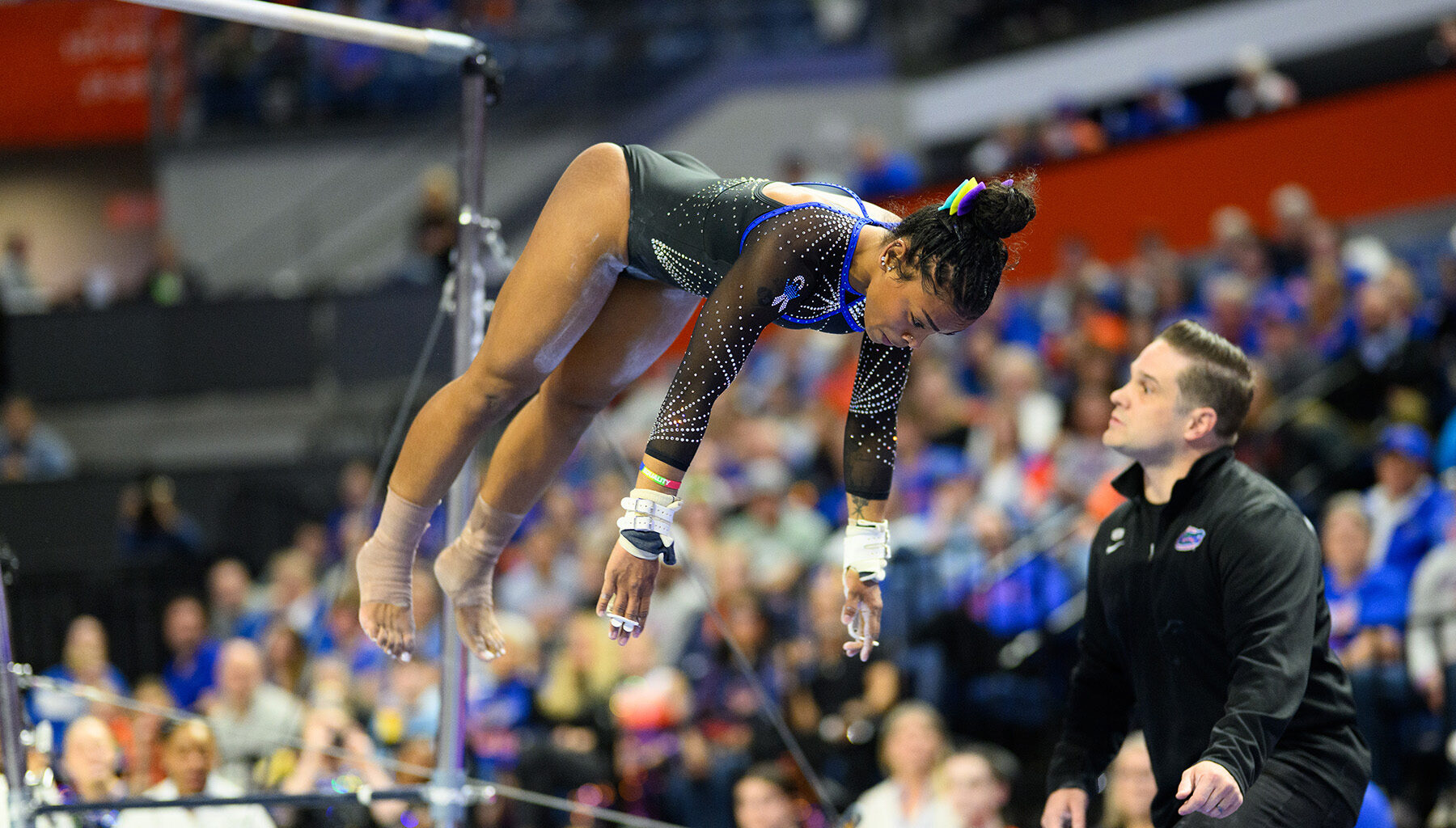 Senior Selena Harris-Miranda dismounts the bars in her first all-around performance of the season against Arkansas.