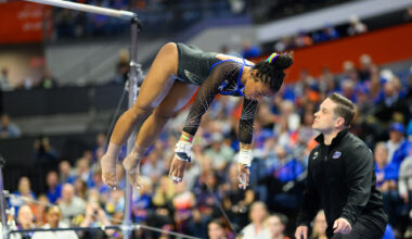 Senior Selena Harris-Miranda dismounts the bars in her first all-around performance of the season against Arkansas.