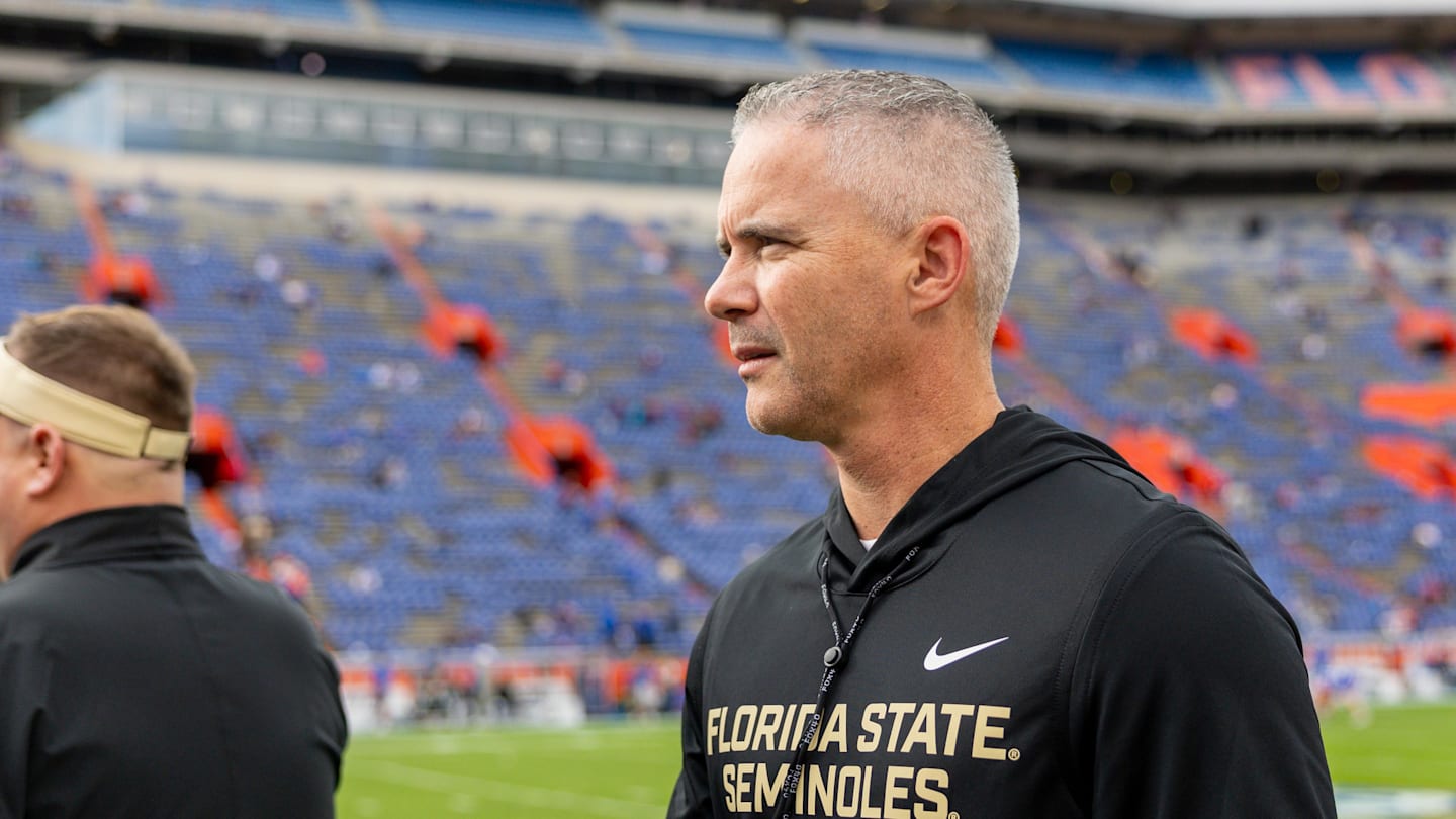Nov 29, 2025; Gainesville, Florida, USA; Florida State Seminoles head coach Mike Norvell walks the sidelines before a game against the Florida Gators at Ben Hill Griffin Stadium. Mandatory Credit: Bob Kupbens-Imagn Images