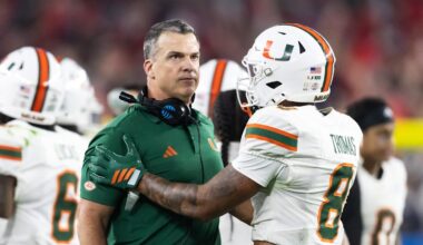 Jan 8, 2026; Glendale, AZ, USA; Miami Hurricanes head coach Mario Cristobal with defensive back Jakobe Thomas (8) against the Mississippi Rebels during the 2026 Fiesta Bowl and semifinal game of the College Football Playoff at State Farm Stadium. Mandatory Credit: Mark J. Rebilas-Imagn Images