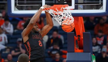 Jan 24, 2026; Syracuse, New York, USA; Miami Hurricanes center Ernest Udeh Jr. (8) dunks during the second half against the Syracuse Orange at the JMA Wireless Dome. Mandatory Credit: Rich Barnes-Imagn Images