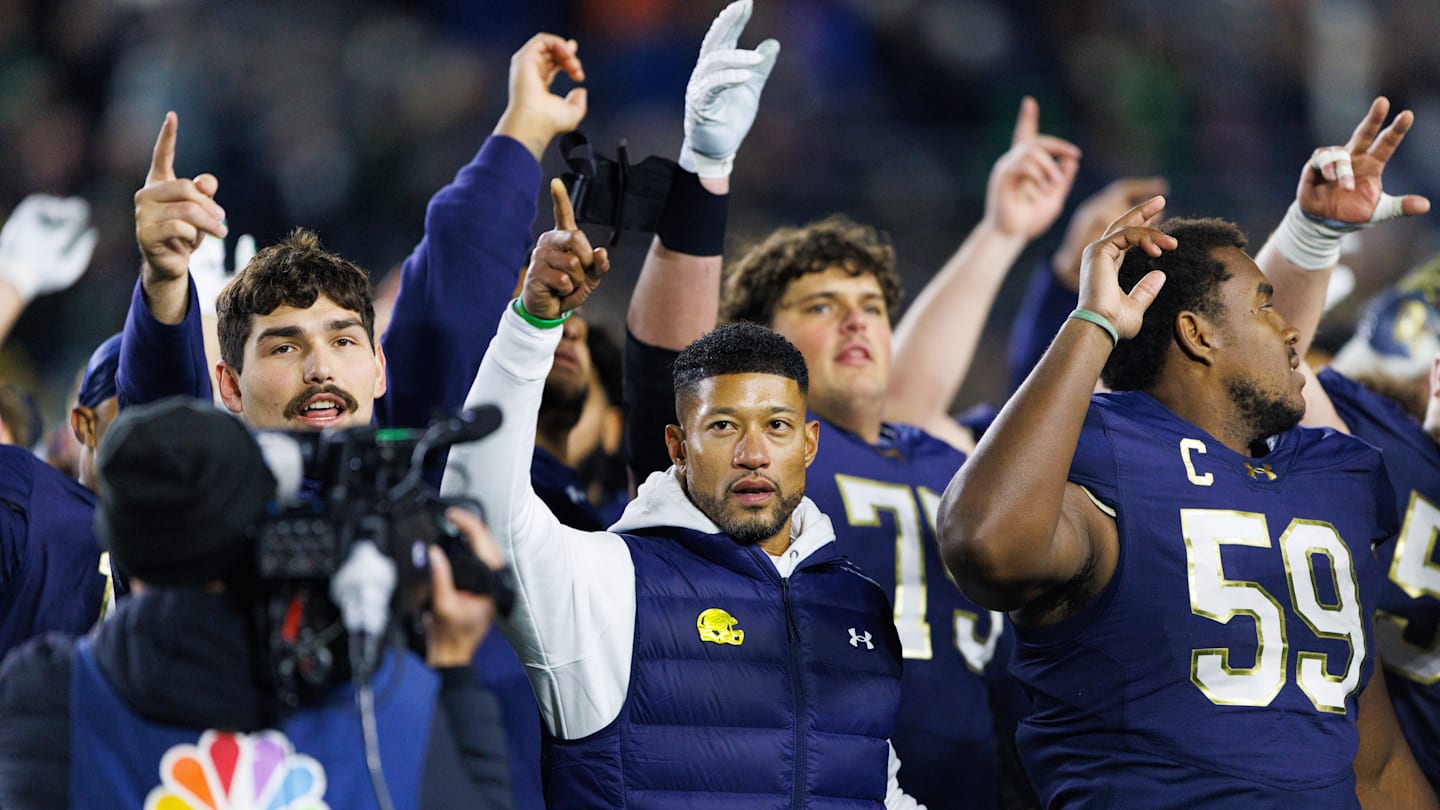 Notre Dame head coach Marcus Freeman celebrates with his players after winning a NCAA football game 70-7 against Syracuse at Notre Dame Stadium on Saturday, Nov. 22, 2025, in South Bend.