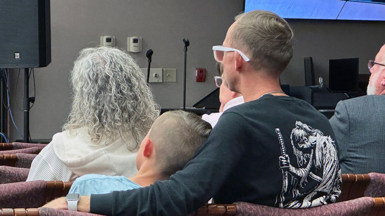 This son and father are Malachi and Michael Gerke. Malachi attends Cross Bayou, and the family was visibly emotional after the vote and left the meeting. (Spectrum Bay News 9/Sarah Blazonis)