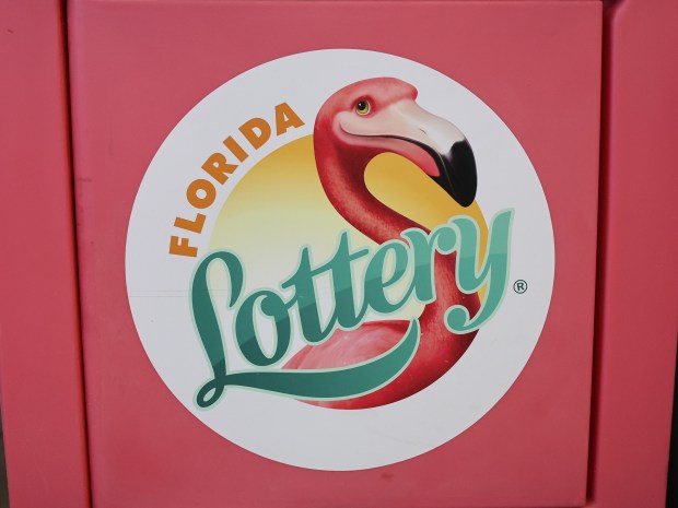 A Florida Lottery stand displays their logo in a Pilot Travel Center in Waldo, Fla. on Monday, Feb. 2, 2026. The flamingo has been a key component of the Florida Lottery's branding since 1988. Legistators are considering the flamingo to replace the mockingbird as Florida's state bird for the third year in a row. (Kaley Mantz/Fresh Take Florida)