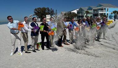 Pinellas County officials and local leaders celebrate finishing the beach nourishment project. (Spectrum News/Jeff Van Sant)