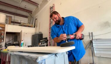 Corey McKeever, seen here working on boat parts, started a petition a month ago against the proposed cruise port. (Spectrum News/Julia Hazel)