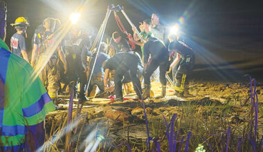 Rescue workers from numerous agencies work to dig out Jacksonville resident Andrew Giddens from quicksand at a Melrose borrow pit Wednesday night. (Photo submitted by Allison Waters-Merritt)