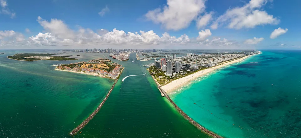 Panoramic view of Miami skyline. Panoramic cityscape of Miami with coastal skyscrapers. Panoramic view of Miami Beach from above. Iconic landmarks line of Miami skyline
