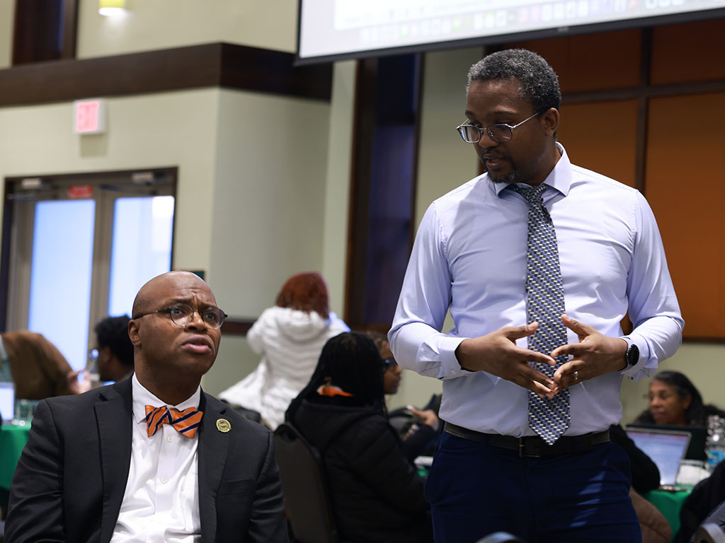Erdell Maurice, Ph.D., engages with attendees during the AI & Data Science Workshop.