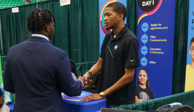 A Florida A&M University student connects with a recruiter during a networking opportunity, exchanging a handshake that could mark the beginning of a future career path.