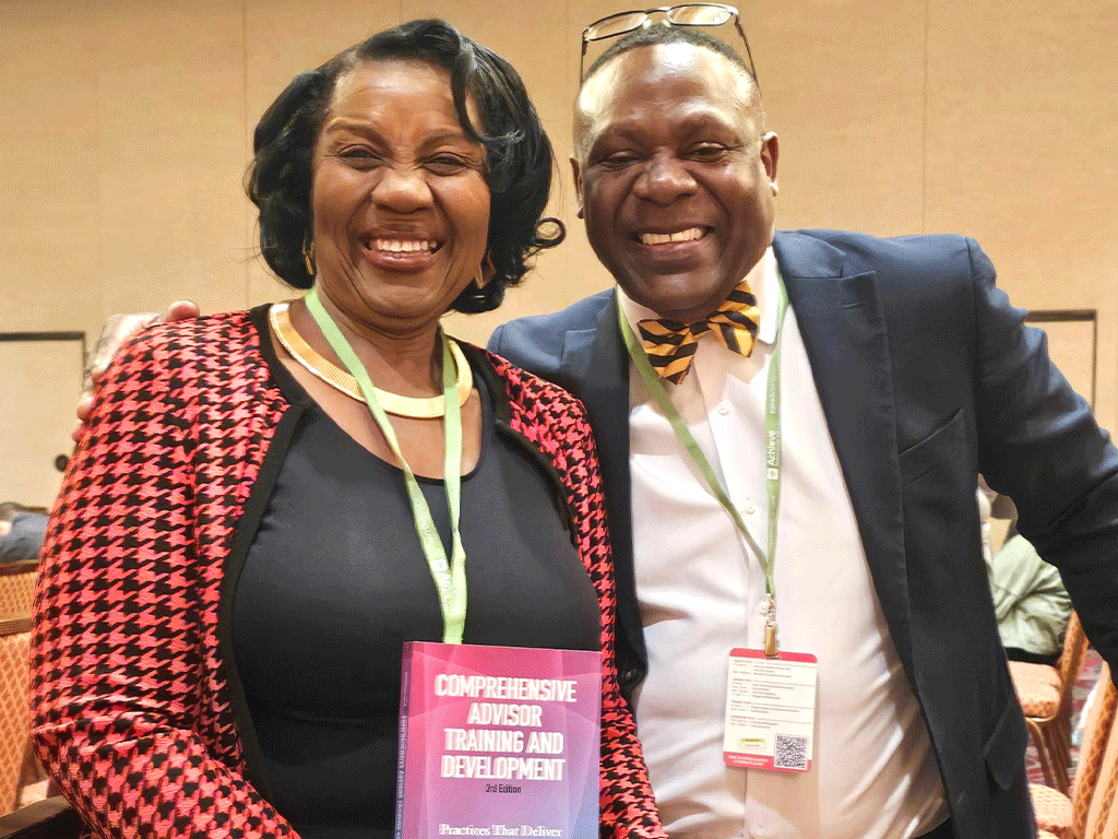 Academic Advisors Smiling at Conference