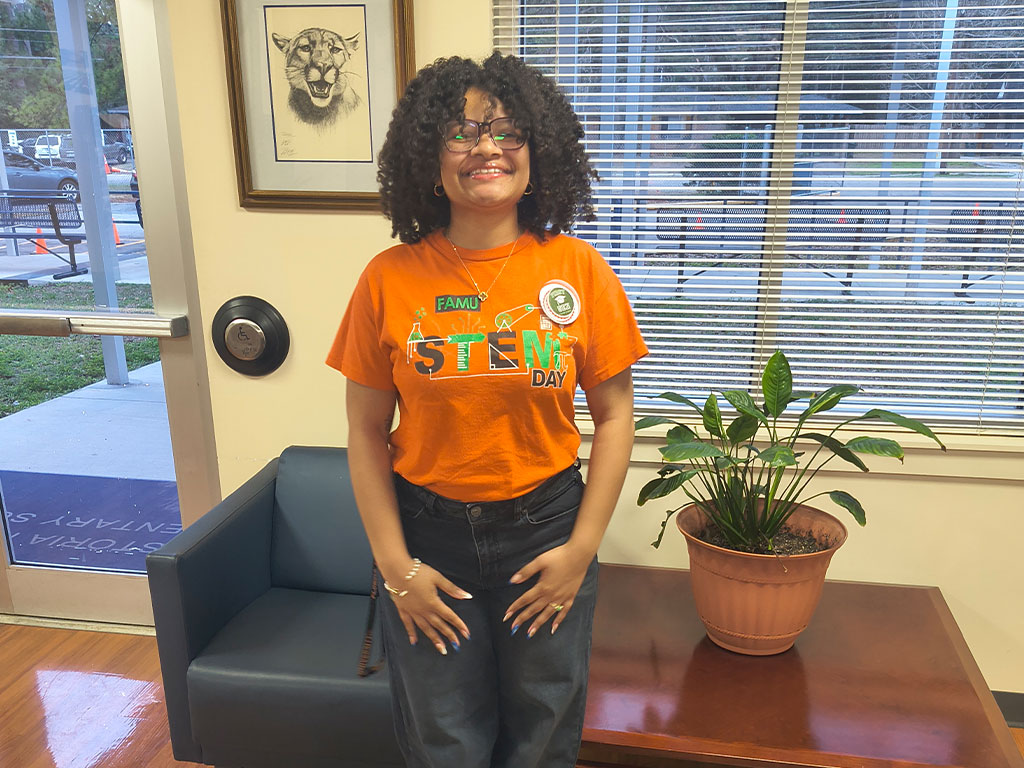 FAMU TRIO students and volunteers engage with local youth during a Read-a-Thon at Astoria Park Elementary School, distributing treats and celebrating academic achievement as part of National TRIO Day.