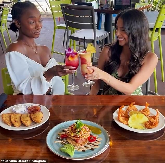 The Orlando-based company announced it will permanently close 14 of Bahama Breeze's 28 restaurants and rebrand the remaining locations under other Darden concepts (pictured: Bahama Breeze customers)