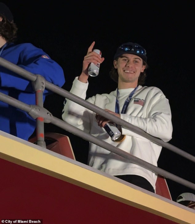 Jack Hughes flashes a toothless grin atop a party bus in the streets of Miami