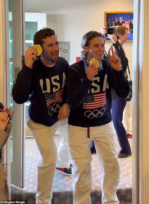 Team USA's Dylan Larkin (left) and Jack Hughes show off their gold medals at the White House