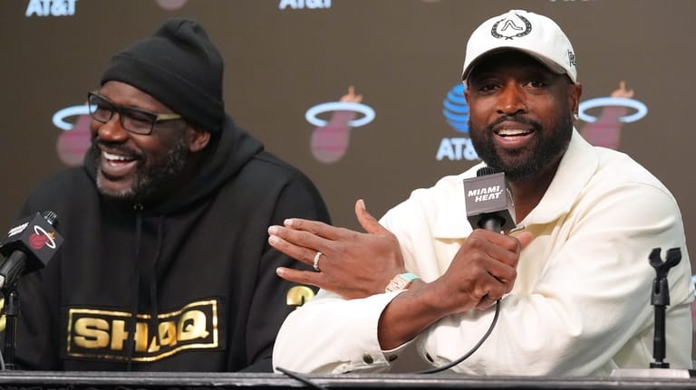 Former Miami Heat players Dwyane Wade, right and Shaquille O'Neal...