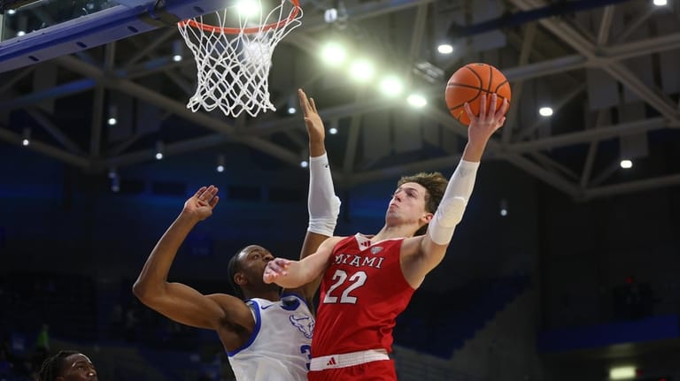 Miami (OH) guard Evan Ipsaro (2) shoots against Buffalo center...