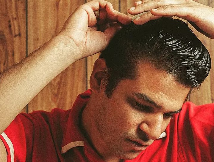 Bloodshot Bill combs his hair