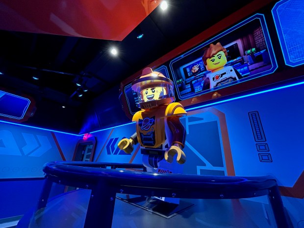 Biff Dipper, a next-generation animatronic for Legoland Florida, greets theme park visitors as part of the queue for the new Galacticoaster. The ride opens to the public Feb. 27. (Dewayne Bevil/Orlando Sentinel)
