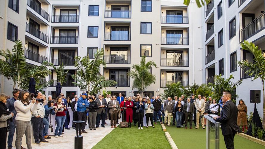 A guest delivers remarks during the opening ceremony for Bimini Square
