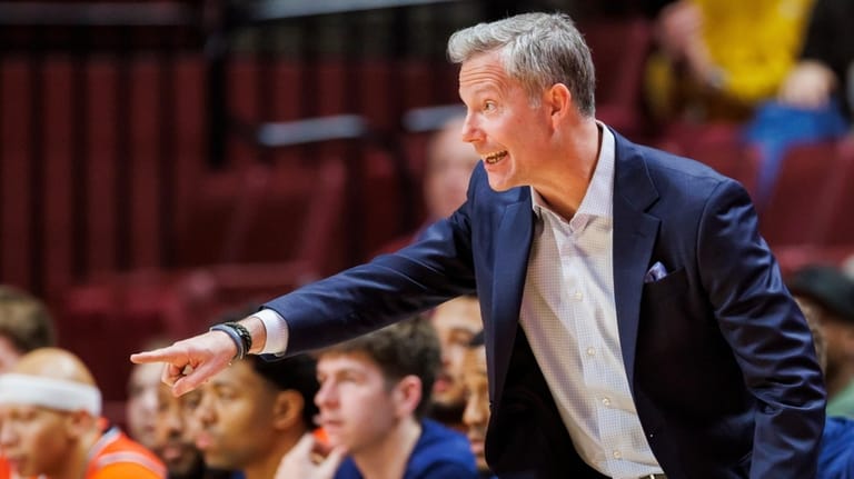 Virginia head coach Ryan Odom directs his team against Florida...