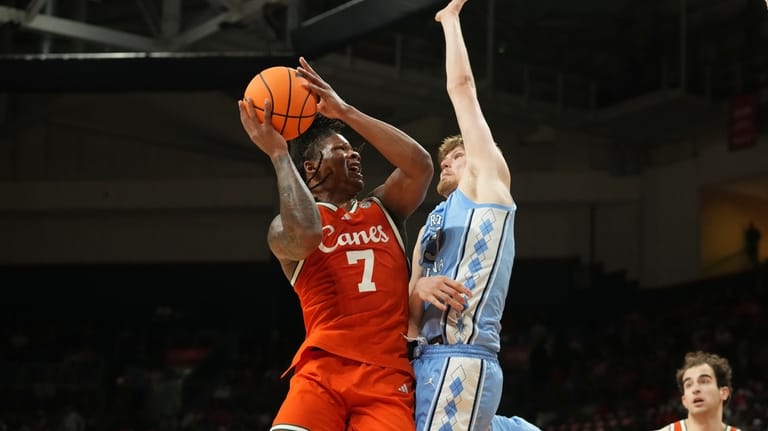 Miami forward Shelton Henderson (7) drives to the basket as...