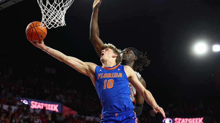 Florida forward Thomas Haugh (10) shoots against Georgia center Somto...