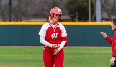 Kendra Lewis celebrates at second base after hitting a double in Texas.