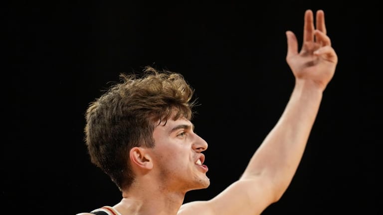 Miami (Ohio) guard Luke Skaljac gestures to the crowd after...