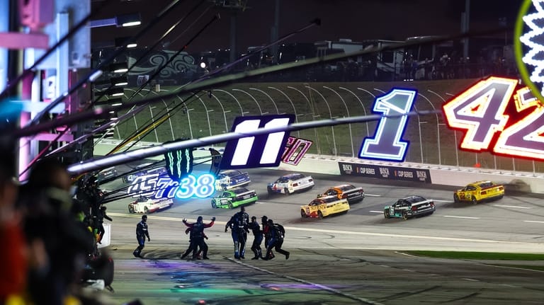 Tyler Reddick's crew reacts after winning a NASCAR Cup Series...