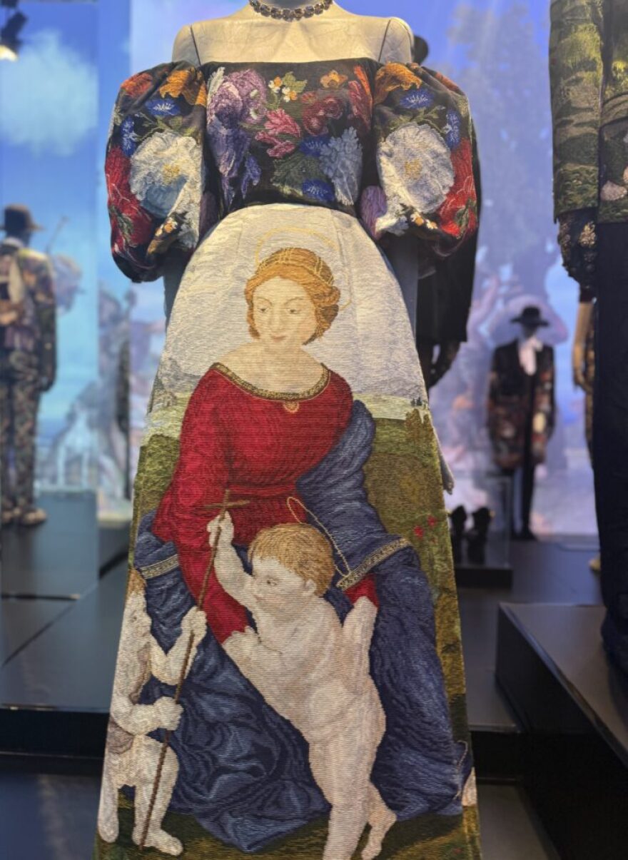 Many garments honor Italy’s Renaissance painters, including this gown bearing a scene from Raphael’s “Madonna in the Meadow.”