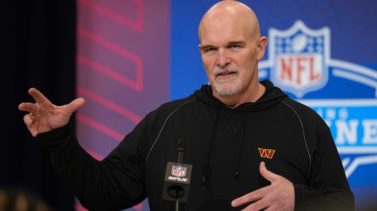 Washington Commanders head coach Dan Quinn speaks during a press...