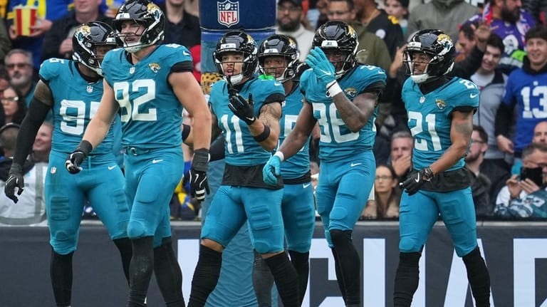 Jacksonville Jaguars wide receiver Parker Washington (11) reacts after his...